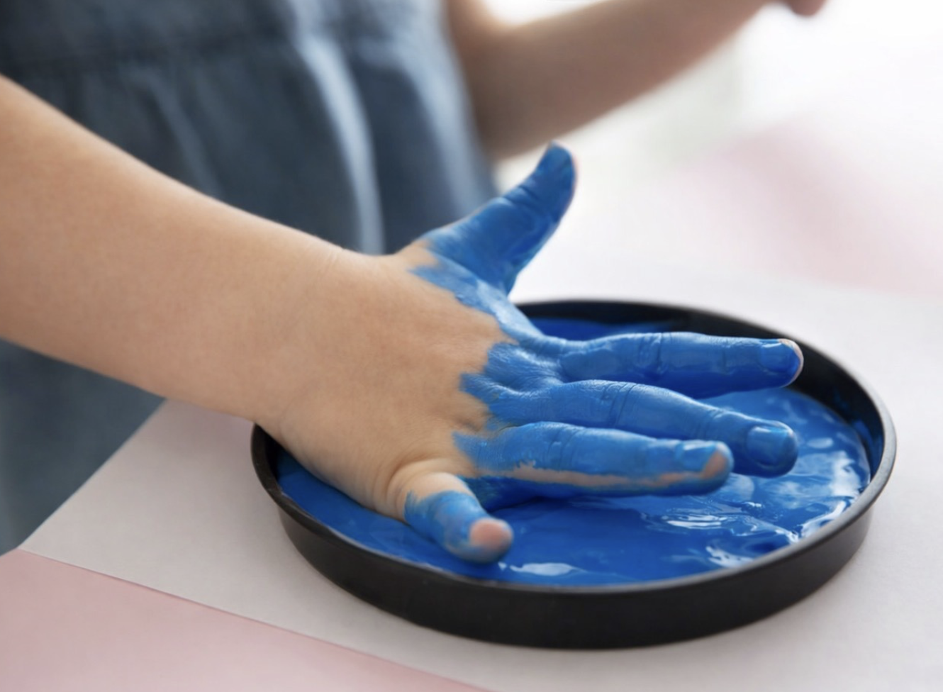 Hand dipped in blue paint